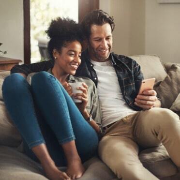 couple relaxing during a carpet cleaning